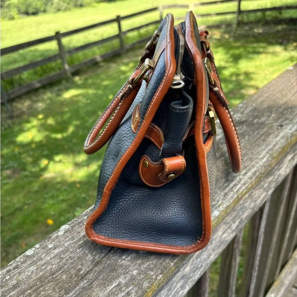 Dooney and Bourke Classic Black and Tan Vintage Leather Handbag